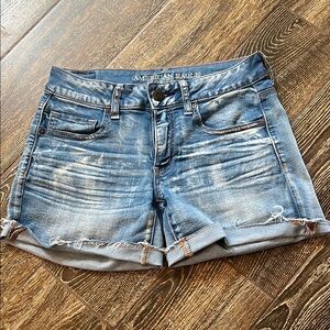 American Eagle Outfitters Women's Distressed Denim Shorts. Midi